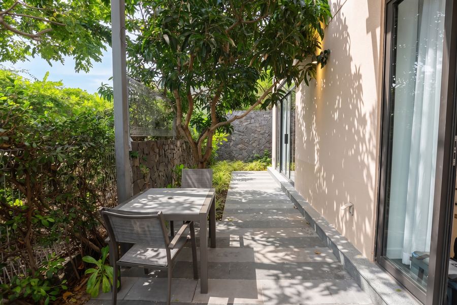 Shaded garden terrace with outdoor dining