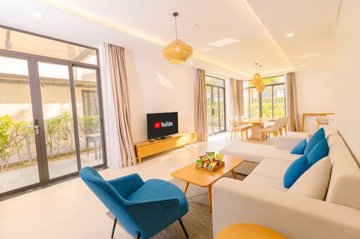 Bright living and dining room of the Ocean View Pool Villa